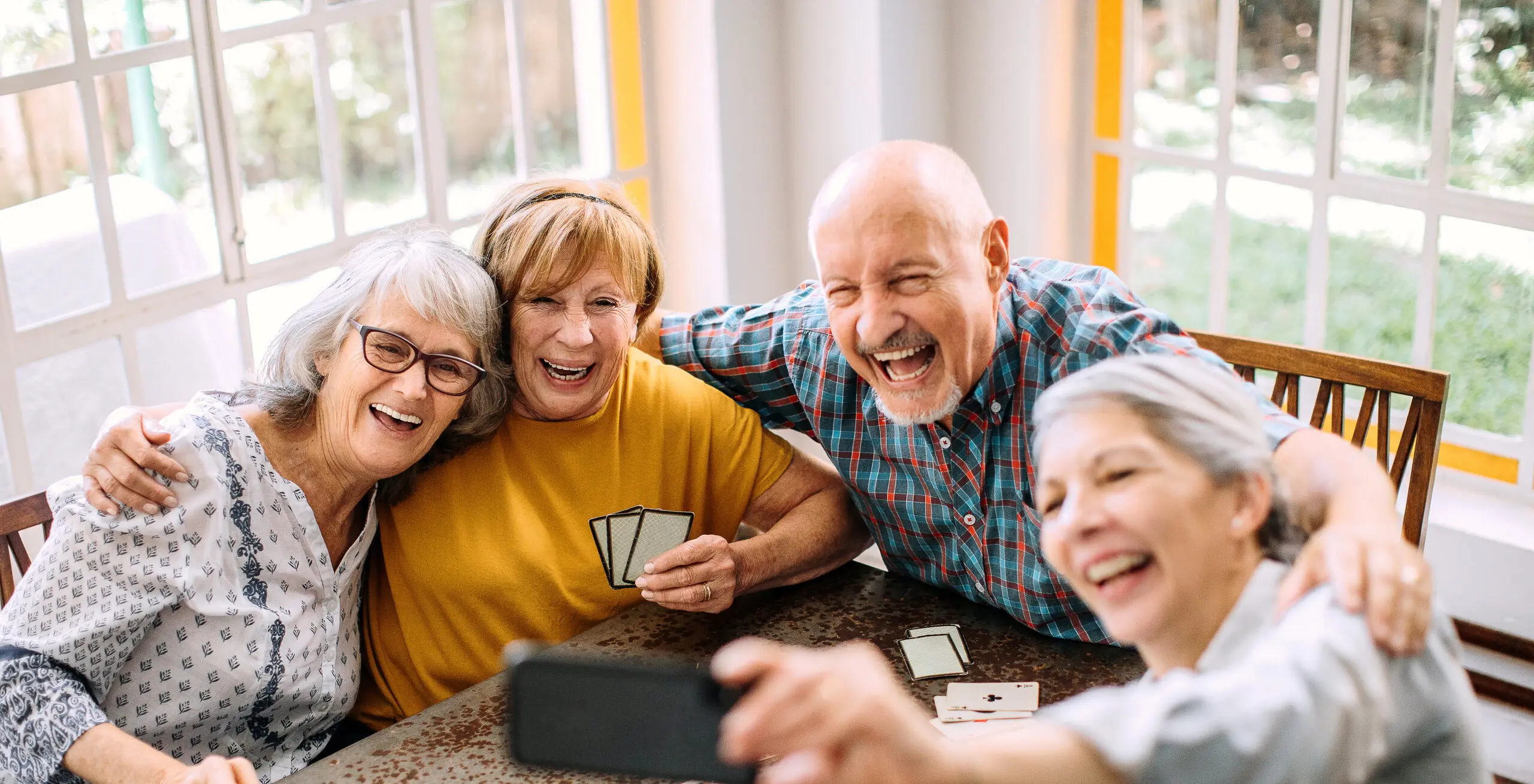 Young at heart seniors having fun time in nursing home